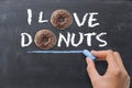 Ã¢â¬ÅI love donutsÃ¢â¬Â concept with tasty chocolate donut on dark background Royalty Free Stock Photo